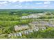 An aerial view of the community, showing nearby trees and landscaping features at 607 Millbrook Dr, Pittsboro, NC 27312