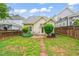 A well-maintained backyard featuring a stone path and lush greenery at 607 Millbrook Dr, Pittsboro, NC 27312