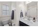 Bathroom featuring a white sink and vanity, gray towels and a window at 607 Millbrook Dr, Pittsboro, NC 27312