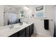 Bathroom featuring a double vanity sink with black cabinets at 607 Millbrook Dr, Pittsboro, NC 27312