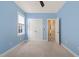 Blue bedroom featuring neutral carpet, a ceiling fan and double closets at 607 Millbrook Dr, Pittsboro, NC 27312