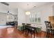 Stylish dining area with hardwood floors, a built-in bench, and an open view to the living room at 607 Millbrook Dr, Pittsboro, NC 27312