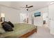 Large main bedroom featuring ceiling fan, and ensuite bathroom and walk in closet at 607 Millbrook Dr, Pittsboro, NC 27312