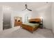 Spacious main bedroom with natural light, ceiling fan, and carpet at 607 Millbrook Dr, Pittsboro, NC 27312