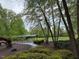 Park with a playground, and a covered seating area, with walking paths and trees at 607 Millbrook Dr, Pittsboro, NC 27312