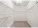 Spacious walk-in closet with wire shelving for ample storage space at 607 Millbrook Dr, Pittsboro, NC 27312