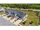 Aerial view of townhomes showcasing the neighborhood layout and landscaping at 608 Creekway Dr, Fuquay Varina, NC 27526