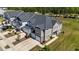 Aerial view of townhomes showcasing the neighborhood layout, lawns and garages at 608 Creekway Dr, Fuquay Varina, NC 27526
