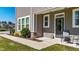 Charming front porch with seating area and manicured landscaping at 608 Creekway Dr, Fuquay Varina, NC 27526
