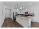 Bright and spacious kitchen with white cabinets, granite countertops, and stainless steel appliances at 608 Creekway Dr, Fuquay Varina, NC 27526