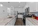 Well-equipped kitchen featuring granite countertops, stainless steel appliances, and ample cabinet space at 608 Creekway Dr, Fuquay Varina, NC 27526