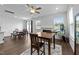 Open-concept living room with a fireplace, ample seating, and easy access to the dining area and kitchen at 608 Creekway Dr, Fuquay Varina, NC 27526