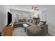 Spacious living room featuring a large sectional sofa, coffee table, and entertainment center, perfect for relaxation at 608 Creekway Dr, Fuquay Varina, NC 27526