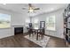 Cozy living room with a fireplace, natural light, and stylish decor perfect for relaxation and gatherings at 608 Creekway Dr, Fuquay Varina, NC 27526