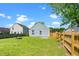 Well-maintained backyard featuring green grass and a fire pit, perfect for outdoor entertaining at 611 Edenberry Dr, Durham, NC 27713