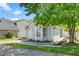 Well-kept single-story home with light blue siding, bay window, and tidy landscaping at 611 Edenberry Dr, Durham, NC 27713