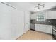 Cozy kitchen features stainless steel appliances and decorative backsplash with tile flooring and recessed spotlight lighting at 611 Edenberry Dr, Durham, NC 27713