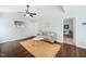 Spacious living room with vaulted ceilings, ceiling fan, and doorway leading to another room at 611 Edenberry Dr, Durham, NC 27713