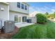 Backyard features a concrete patio, lawn, and the home's exterior at 614 Canyon Lake Cir, Morrisville, NC 27560
