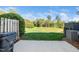 Backyard features a concrete patio, spacious lawn, and privacy fence at 614 Canyon Lake Cir, Morrisville, NC 27560