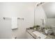 Elegant bathroom with a granite countertop and a decorative mirror, offering a touch of luxury and comfort at 614 Canyon Lake Cir, Morrisville, NC 27560