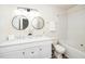 Bright bathroom with double vanity, modern lighting, and a shower/tub combo at 614 Canyon Lake Cir, Morrisville, NC 27560