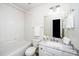 Bathroom with a single vanity, tub-shower, and neutral color palette at 614 Canyon Lake Cir, Morrisville, NC 27560