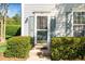 Cozy front porch with a glass storm door and verdant hedges framing the entryway, adding charm at 614 Canyon Lake Cir, Morrisville, NC 27560