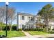 Charming townhome with a well-manicured lawn and fresh exterior paint, creating a welcoming curb appeal at 614 Canyon Lake Cir, Morrisville, NC 27560