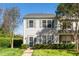 Inviting two-story townhome with green shutters and landscaped front yard, perfect for low-maintenance living at 614 Canyon Lake Cir, Morrisville, NC 27560