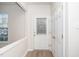 Bright foyer with hardwood floors, offering convenient access to a coat closet and living spaces at 614 Canyon Lake Cir, Morrisville, NC 27560