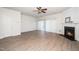 Bright living room with wood floors, fireplace, and sliding glass door to outdoor space at 614 Canyon Lake Cir, Morrisville, NC 27560