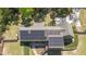 Aerial view of the property, highlighting the solar panels and surrounding landscape at 626 Bailey Rd, Coats, NC 27521