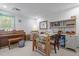 Versatile bonus room offering space for recreation and storage with a piano and desk at 626 Bailey Rd, Coats, NC 27521
