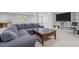 Basement area offering a comfy sectional sofa, and a stylish coffee table at 626 Bailey Rd, Coats, NC 27521