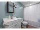 Bathroom with vanity and sink, a toilet, and a bathtub with shower at 626 Bailey Rd, Coats, NC 27521