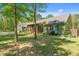 View of the front of the home showcasing a charming porch and landscaped front yard at 626 Bailey Rd, Coats, NC 27521
