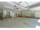 Spacious garage with ample storage, work area, and an access to the house at 626 Bailey Rd, Coats, NC 27521