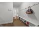 Hallway featuring storage bench with shoe rack and wall hooks for organization and convenience at 626 Bailey Rd, Coats, NC 27521