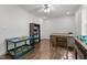 Versatile room with desk and storage, offering an ideal space for work or study with ample natural light at 626 Bailey Rd, Coats, NC 27521