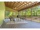 Cozy screened porch with comfortable seating, perfect for outdoor relaxation at 626 Bailey Rd, Coats, NC 27521