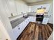 Modern kitchen with white cabinets, stylish granite countertops, and stainless steel appliances, perfect for cooking at 710 Dothan Ave, Burlington, NC 27217