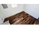 Corner space with hardwood floors and white walls, providing a versatile area for various uses at 710 Dothan Ave, Burlington, NC 27217