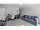 Versatile room with plush carpet, sofa, desk, and piano, perfect for relaxation or creativity at 712 Wellspring Dr, Holly Springs, NC 27540