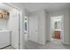 Hallway with Laundry room and Bathroom at 712 Wellspring Dr, Holly Springs, NC 27540
