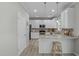 Bright kitchen with modern appliances and granite counters at 712 Wellspring Dr, Holly Springs, NC 27540