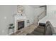 Inviting living room featuring a fireplace, and staircase at 712 Wellspring Dr, Holly Springs, NC 27540