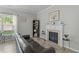 Cozy living room featuring a fireplace and black bookcase at 712 Wellspring Dr, Holly Springs, NC 27540