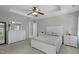 Spacious main bedroom boasts a tray ceiling, fan, and stylish white furniture set for a serene retreat at 712 Wellspring Dr, Holly Springs, NC 27540