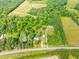 An aerial view of a large lot, including various houses and outbuildings at 7129 Dexter Rd, Oxford, NC 27565